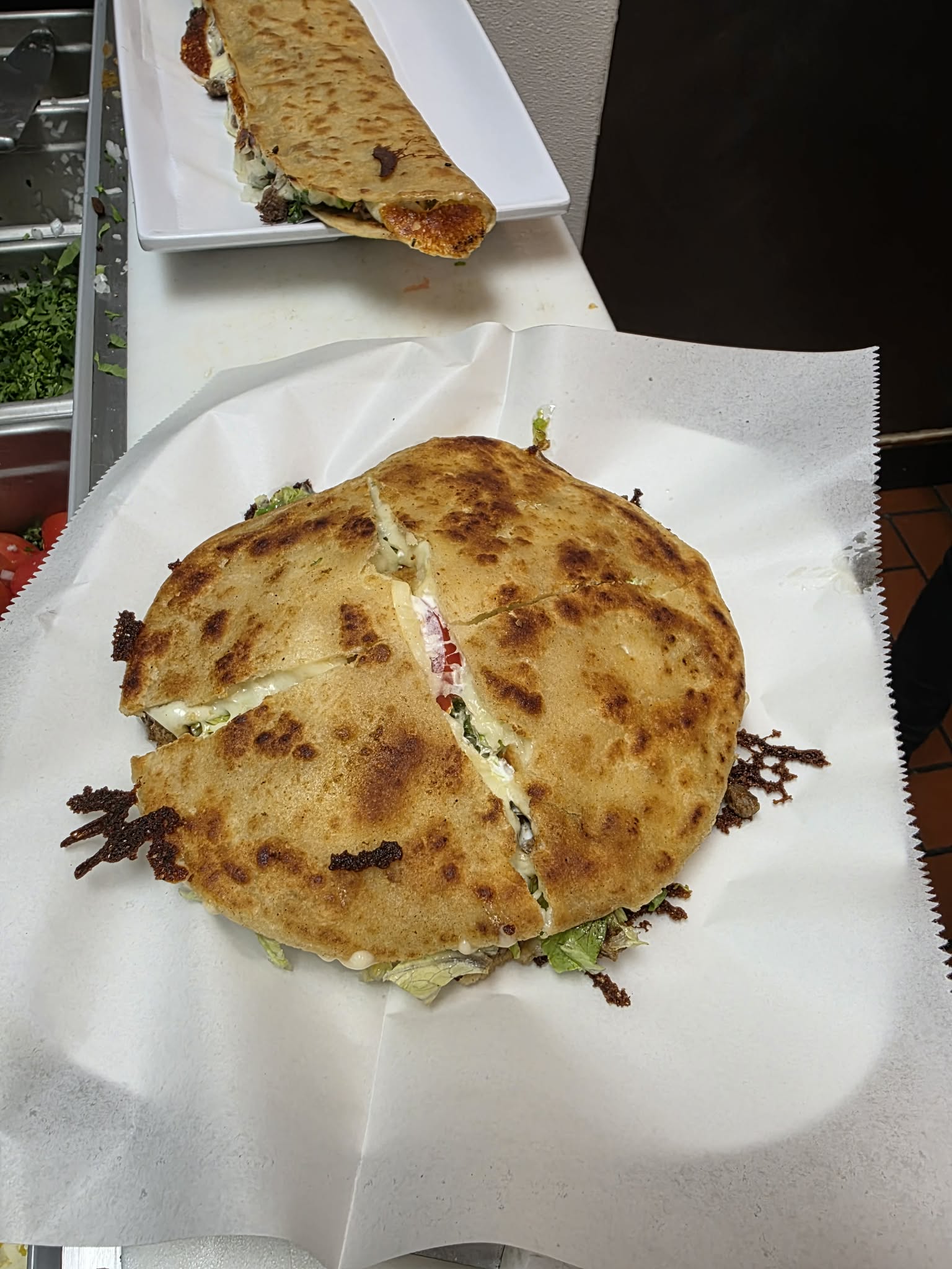 Golden quesadilla cut into portions