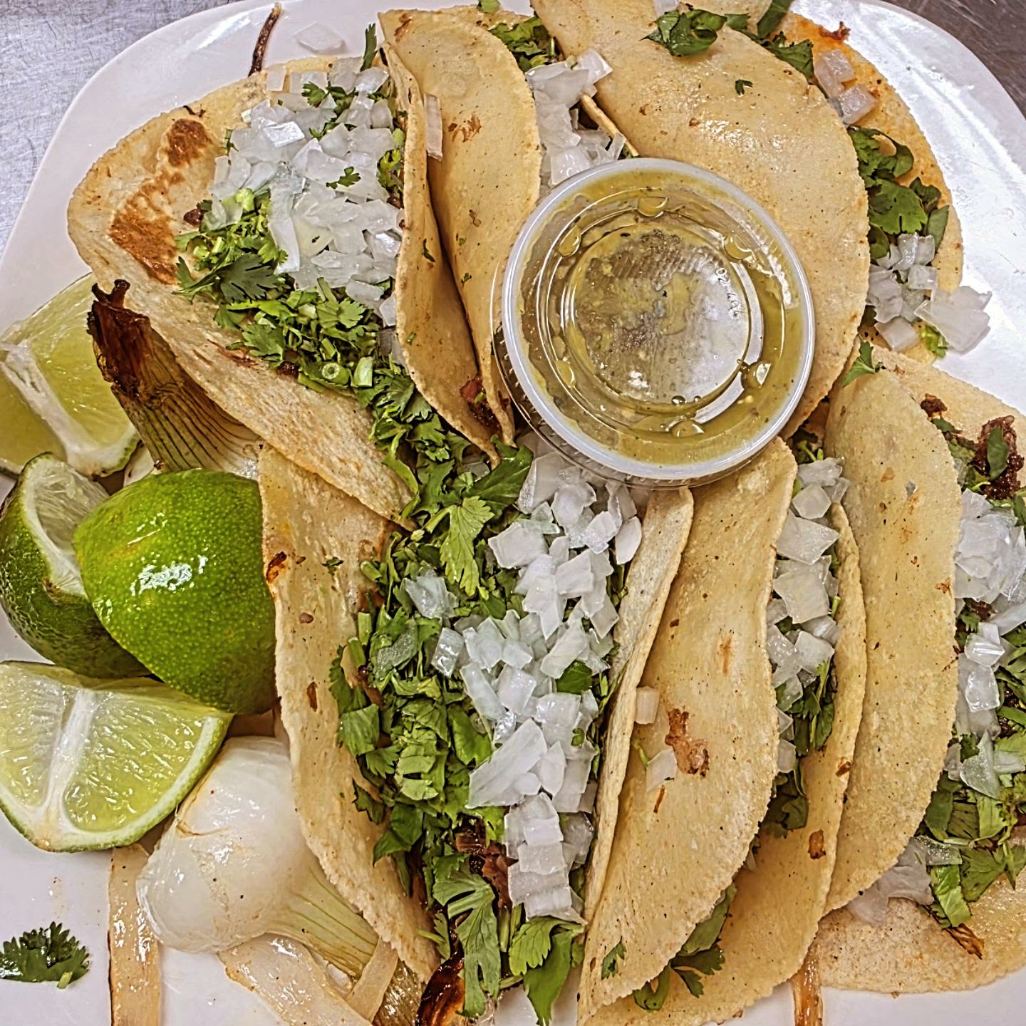 Mexican tacos served with lime and salsa